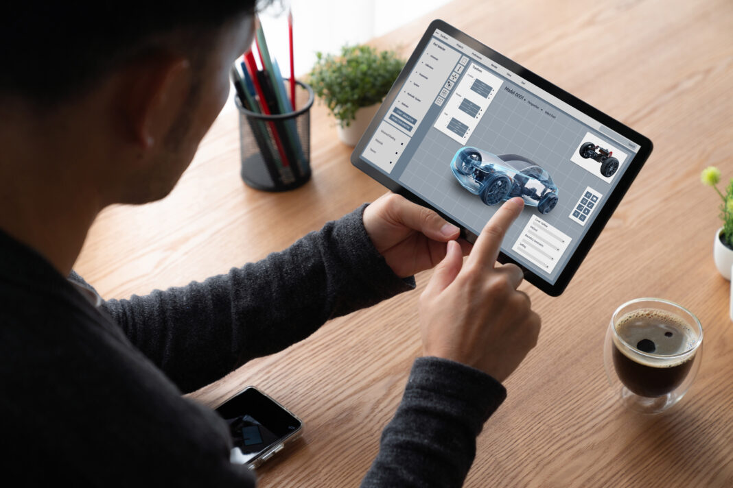 Electric car design software on computer screen show simulation blueprint snugly